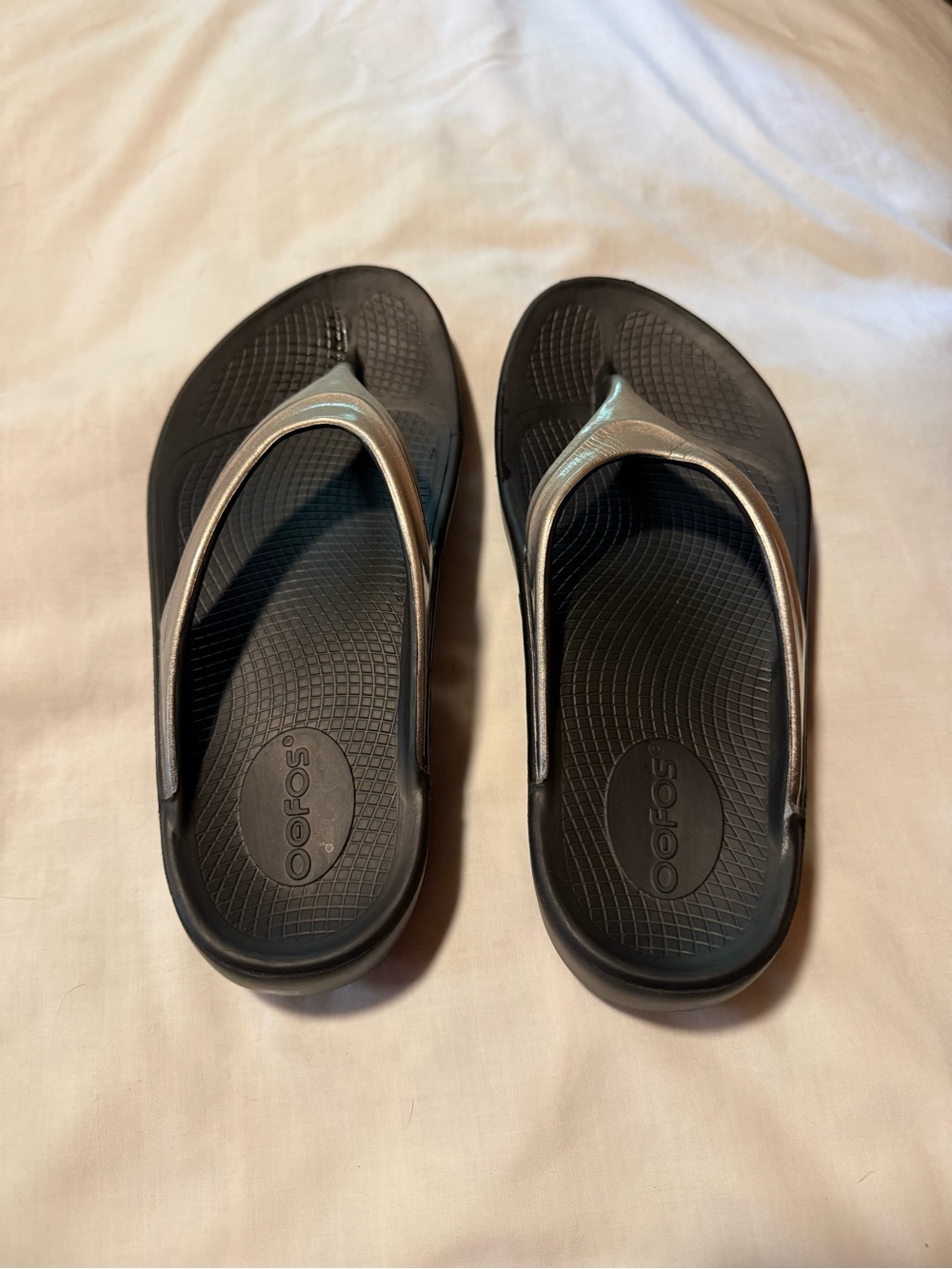 OOFOS Black Flip Flops with Metallic Silver Straps